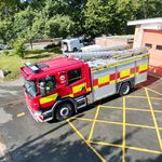 Fire engine in front of station taken from above