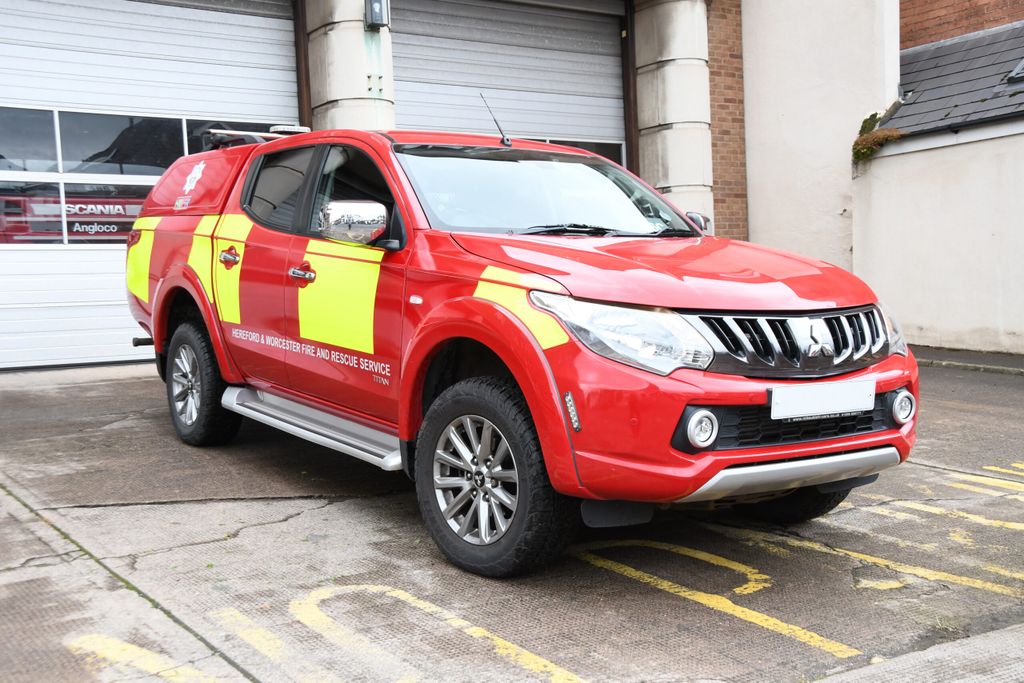 crew carrier pictured in front of fire station bay