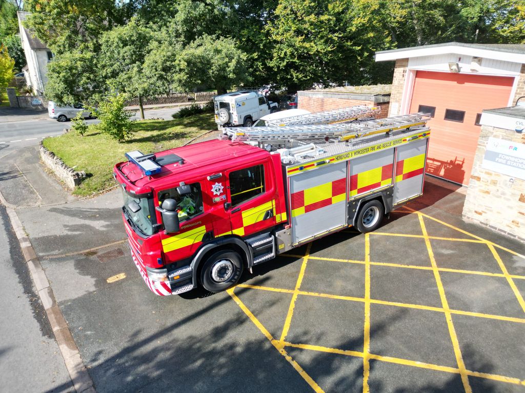 Fire engine in front of station taken from above