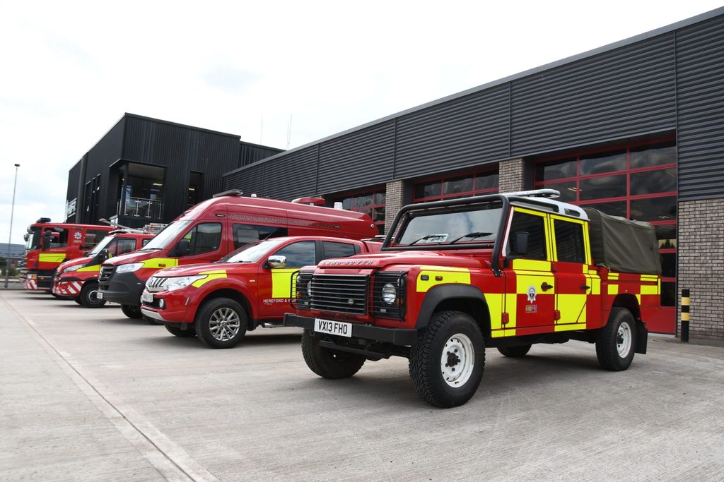 Fire vehicles in front of station taken from the side