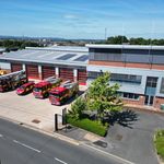 Drone image of fire station with fire vehicles