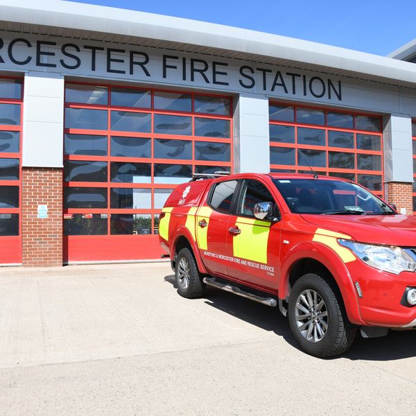 Crew carrier in front of fire station shutter