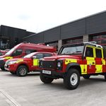 Fire vehicles in front of station taken from the side