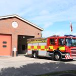 Fire engine in front of fire station