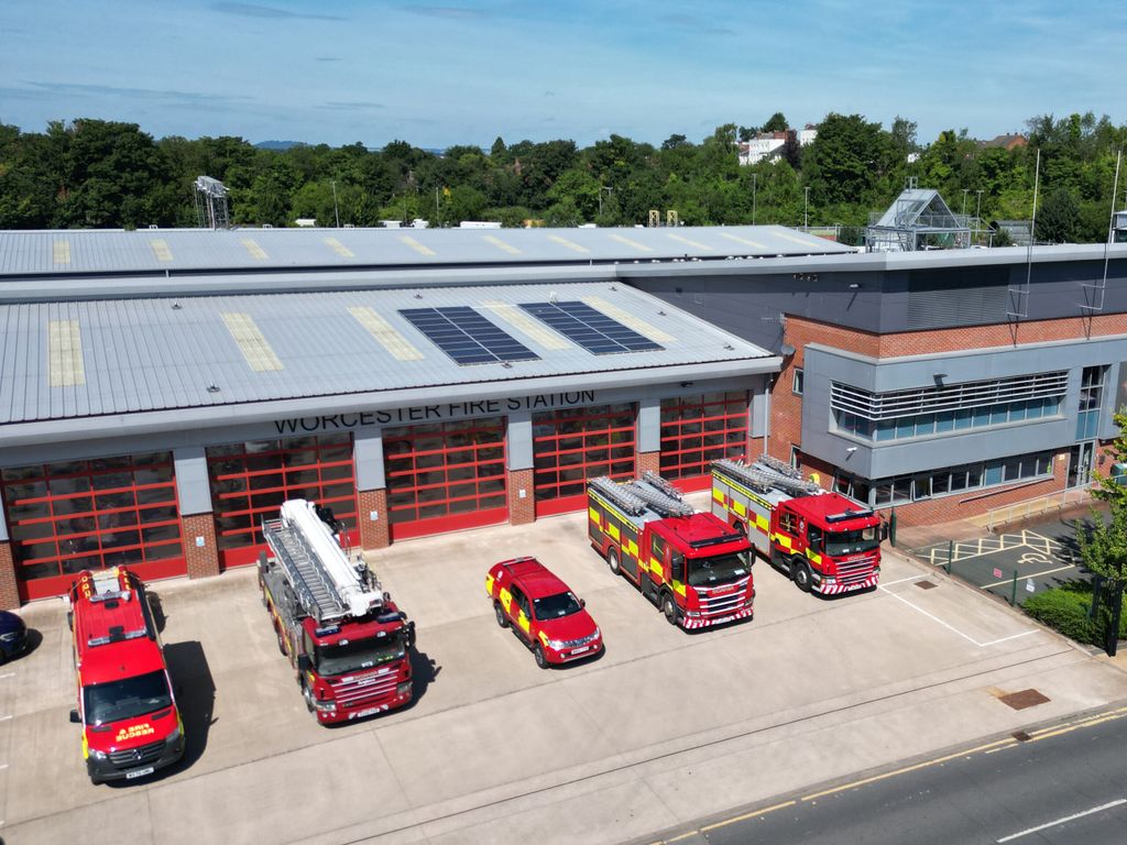 Fire vehicles in front of station taken from above